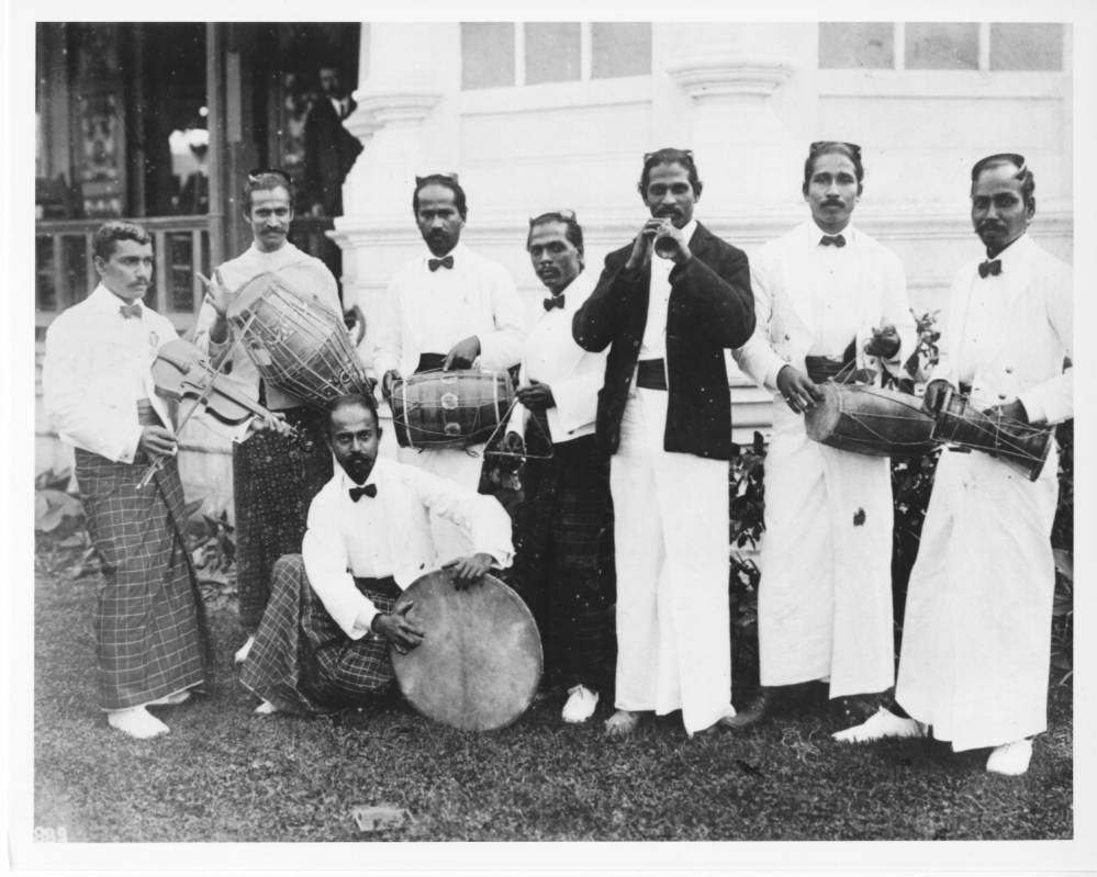 <p>The Sinhalese musicians, along with Sinhalese dancers, performed in the Mysterious Asia concession on the Pike. Number 889: The number ‘889’ is written at the lower left-hand corner of the photograph.</p>
