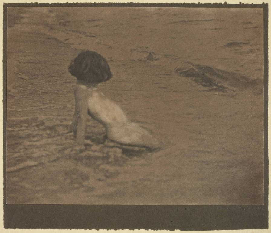 <p>Young child — four years old — playing in surf at the beach. Signed: Grace Parrish, 1927.</p>

